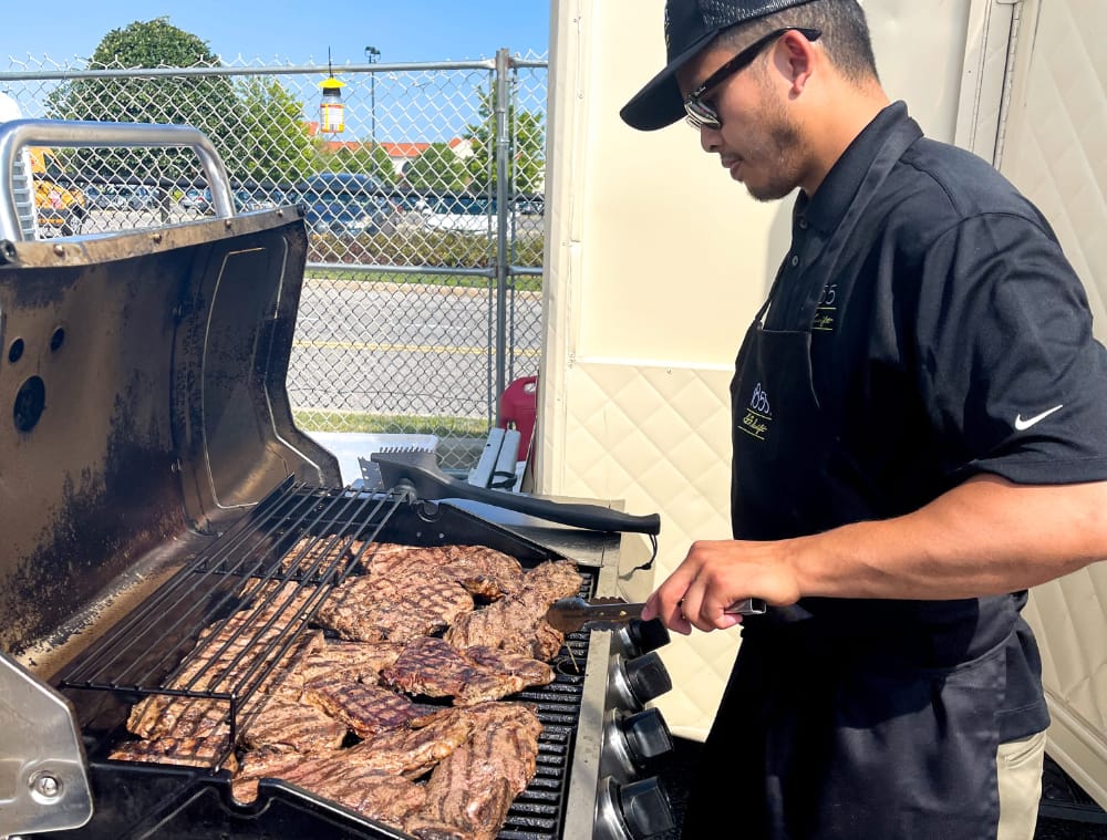 chef tim flores grilling black angus top sirloin for bistek sliders